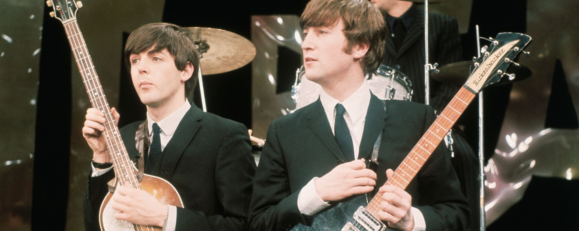 Paul McCartney and John Lennon performing