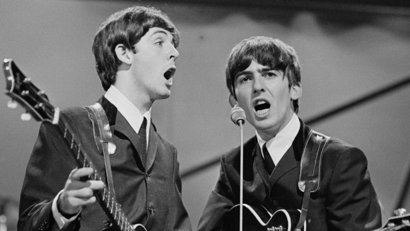 Paul McCartney and George Harrison performing