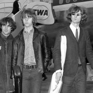 The Byrds walking on tarmac