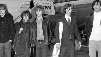 The Byrds walking on tarmac