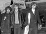 The Byrds walking on tarmac