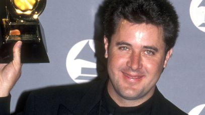 Vince Gill holding Grammy award