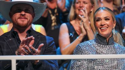 Cody Johnson and Carrie Underwood sitting together