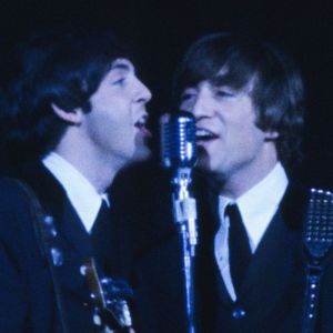 Paul McCartney and John Lennon performing