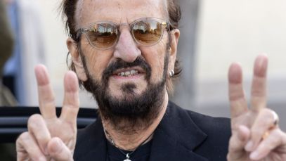 Ringo Starr making peace signs