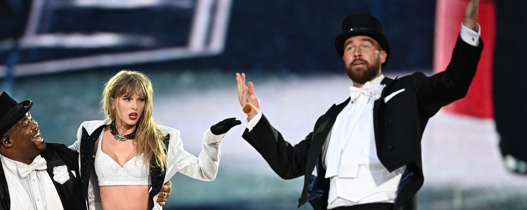 Travis Kelce Gives Taylor Swift The Eras Tour “22” Hat During a Kansas City Suprise Party