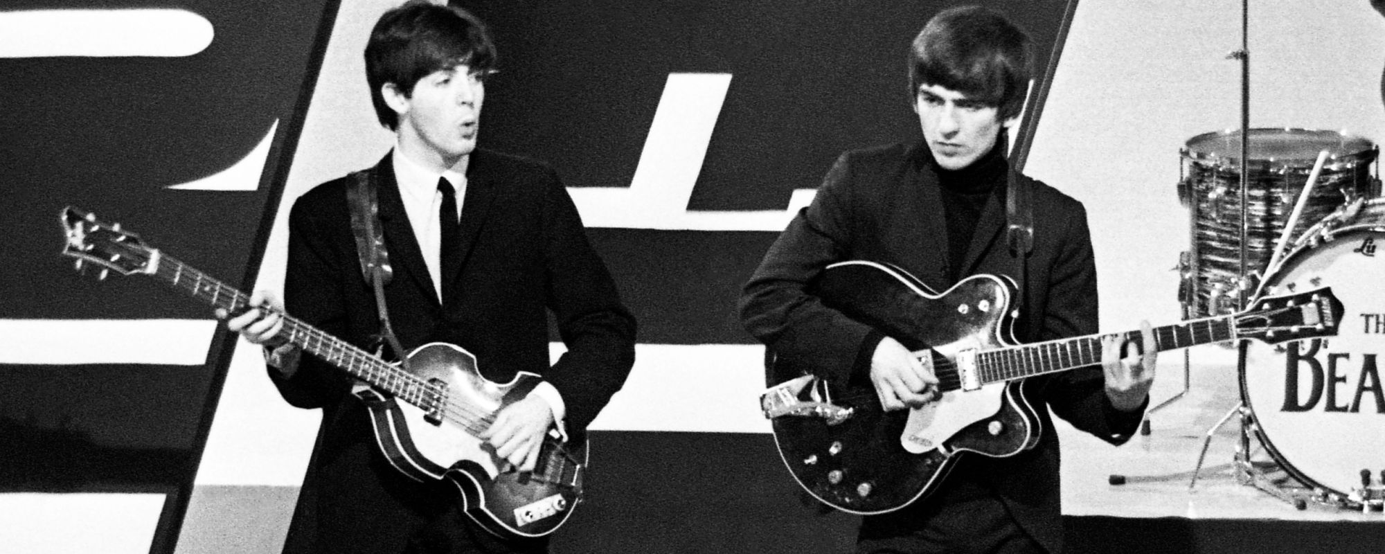 Paul McCartney and George Harrison performing