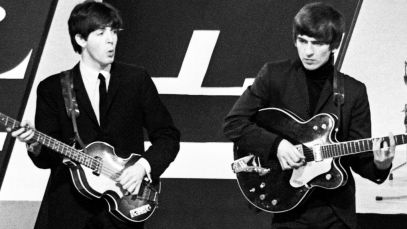 Paul McCartney and George Harrison performing