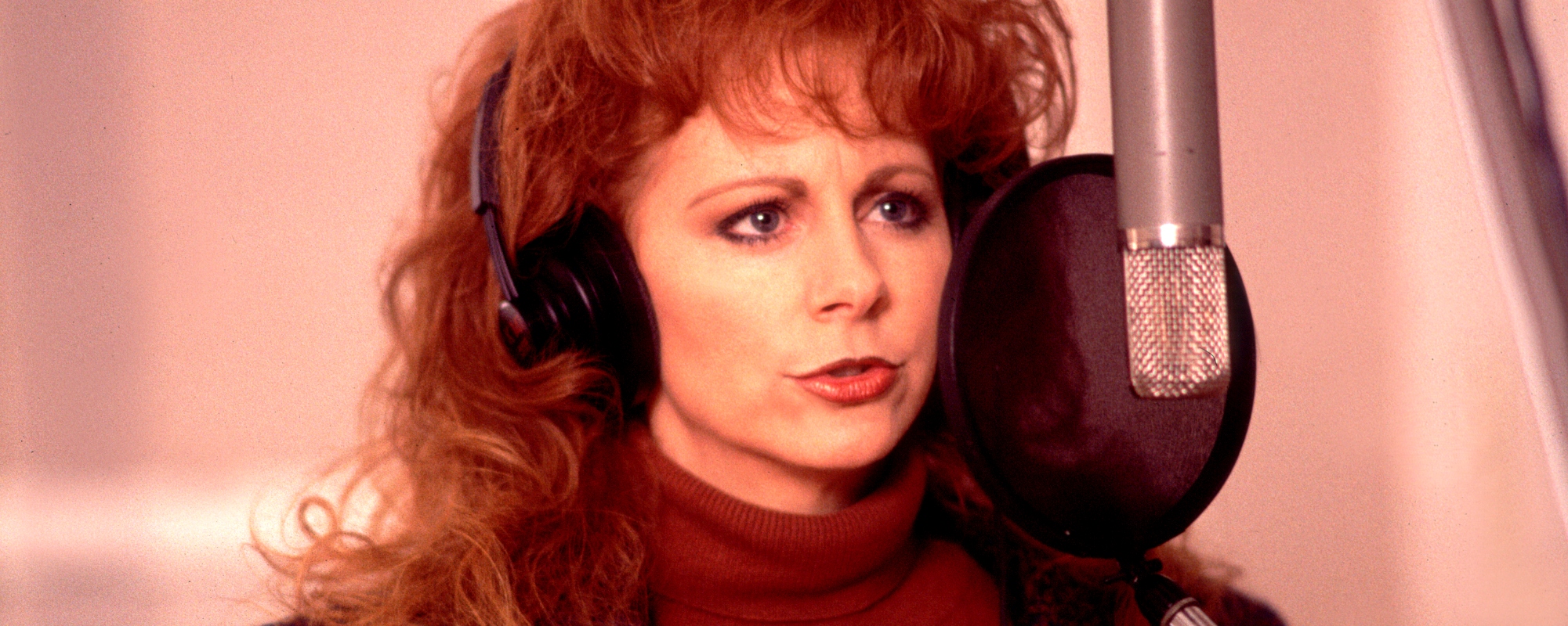 A Red Dress, a Roach, and a Dream: The Enduring Power of Reba McEntire's ' Fancy' - American Songwriter