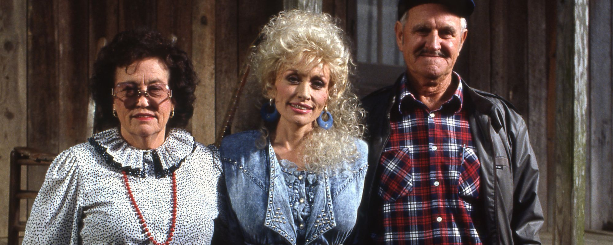 Dolly Parton posing with her parents