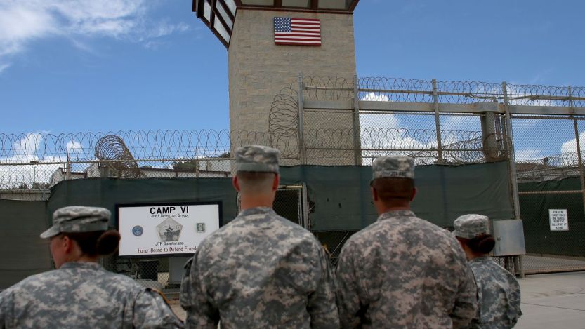 U.S. soldiers standing outside of government detention camp Guantanamo Bay