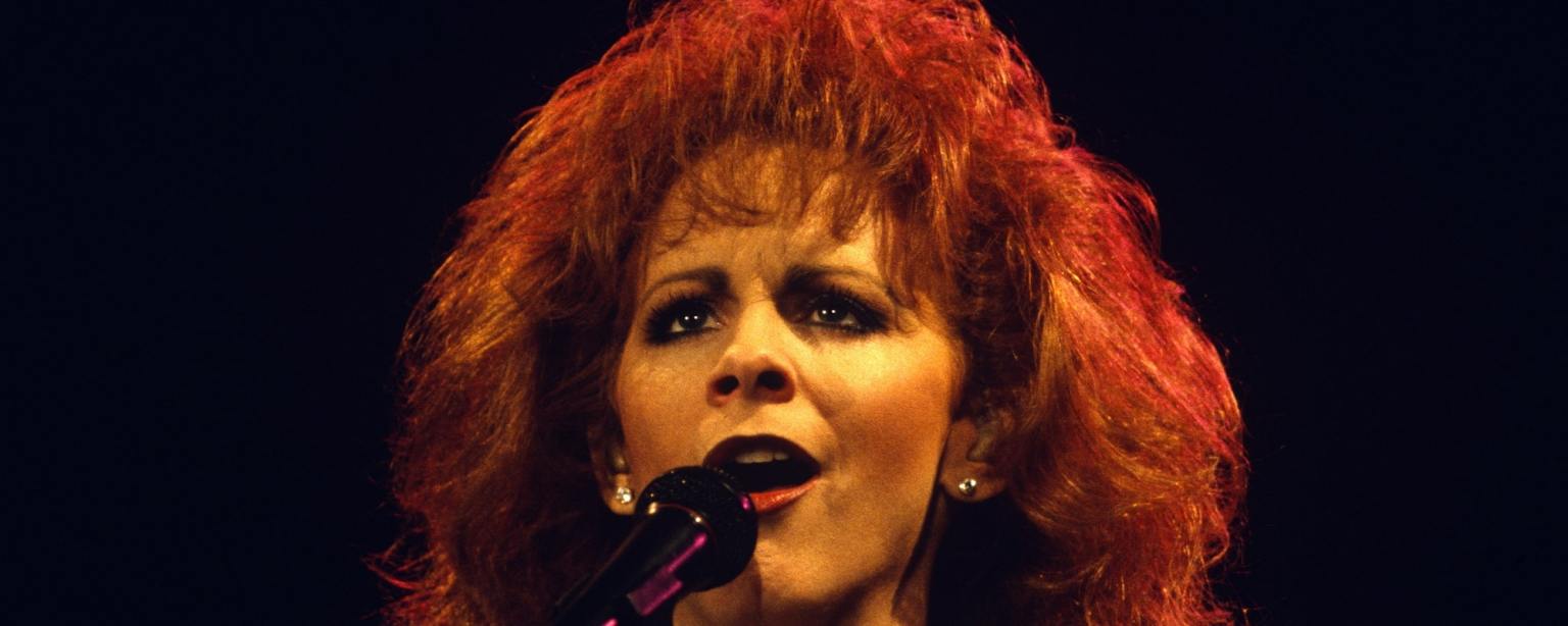 The Story Behind "Cathy's Clown" by Reba McEntire and How She Delivered Her Own Take on The