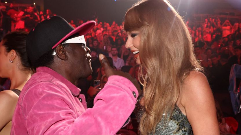 “King Swiftie” Flavor Flav Becomes First-Ever ‘Masked Singer’ Contestant To Cover Taylor Swift