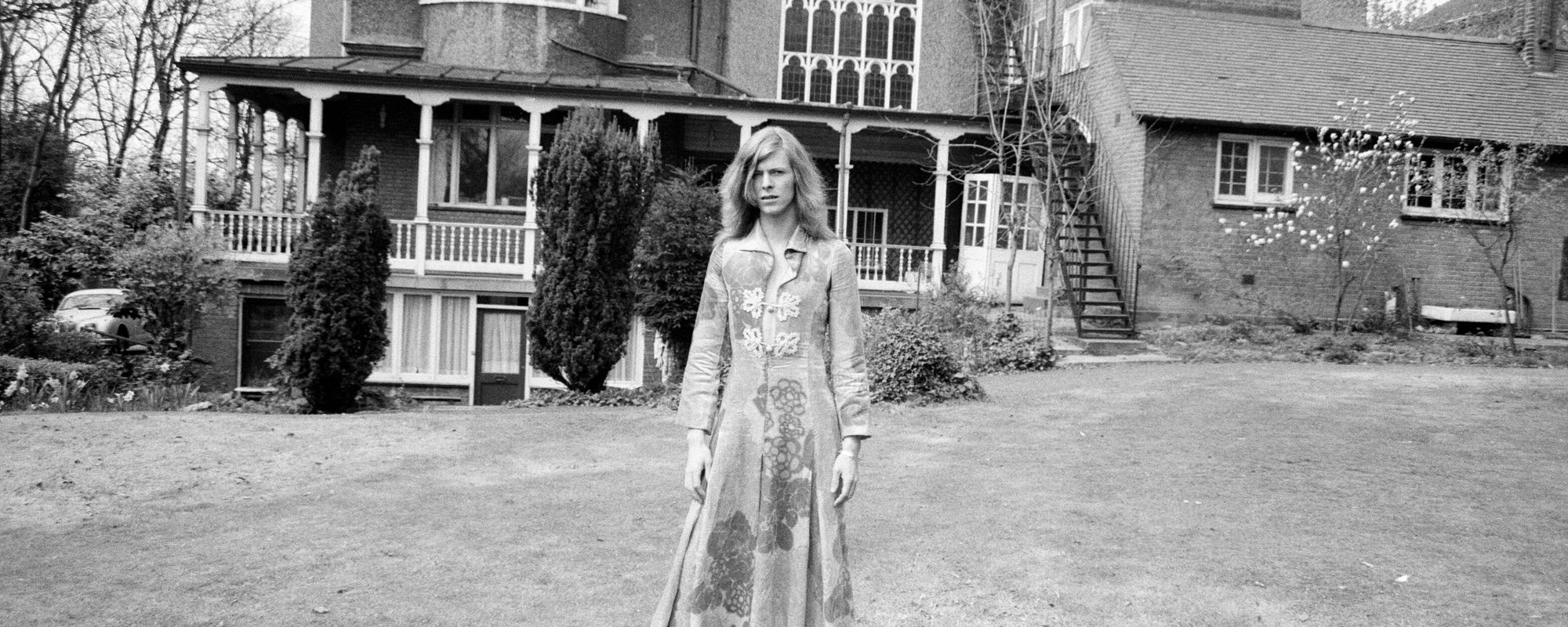 Musical icon David Bowie in front of historic home from the 1970s