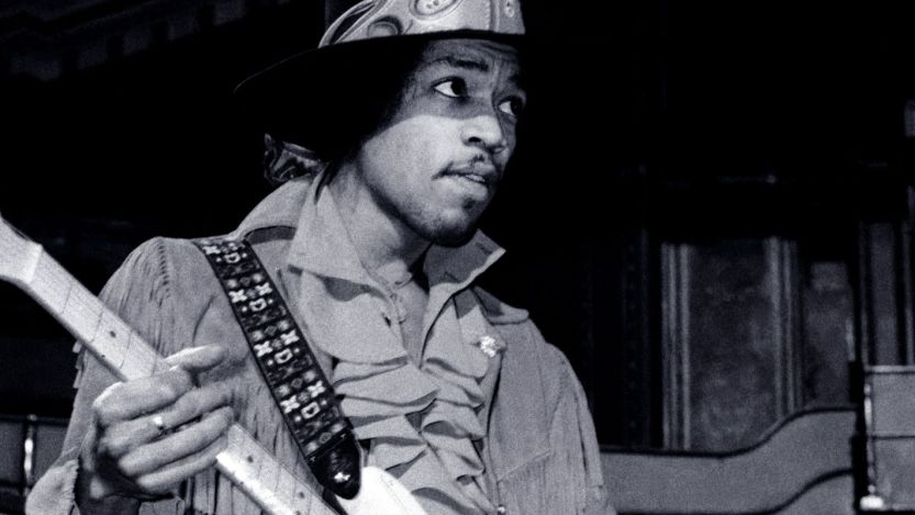 Jimi Hendrix performing