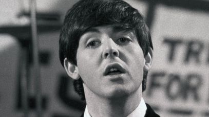 Paul McCartney performing with the Beatles