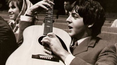 Paul McCartney playing guitar