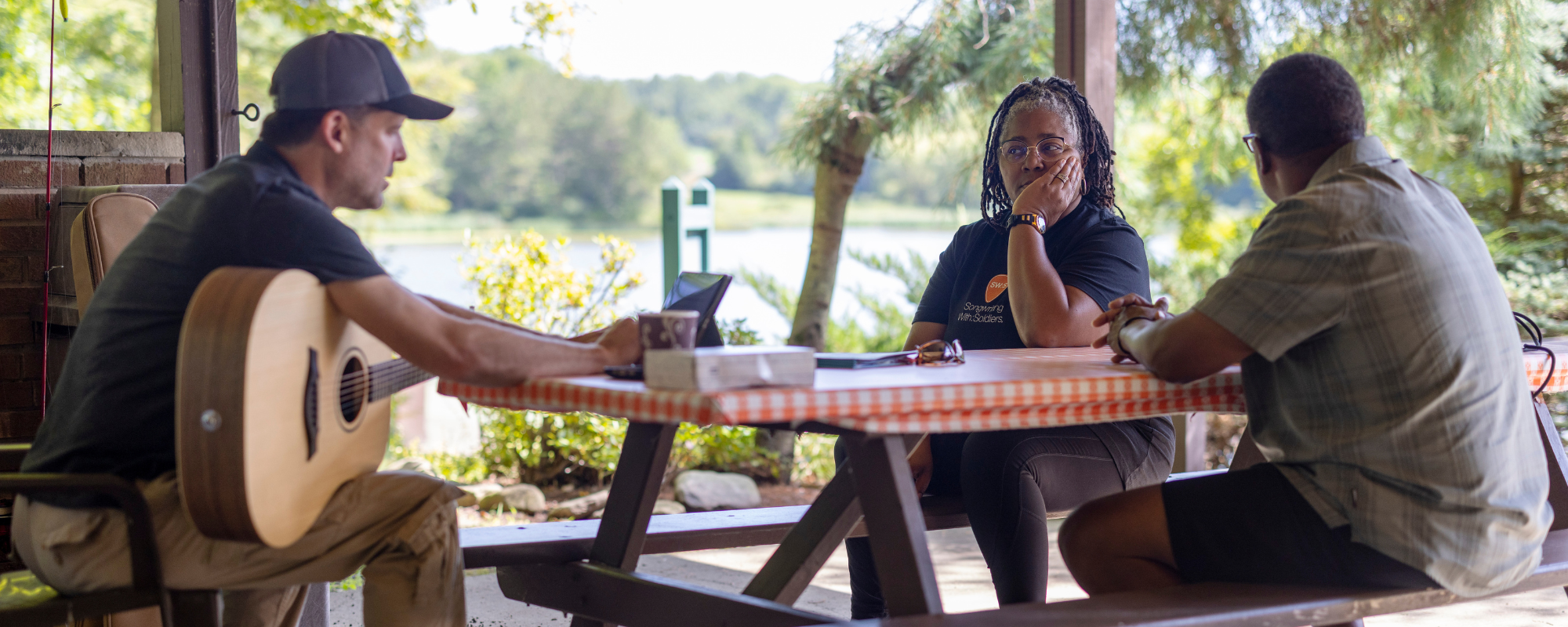 Trent Willmon helps Bruce and Lesley Anderson write a song. Photo by Rick Loomis