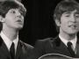 Paul McCartney and John Lennon of the Beatles performing