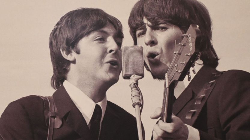 Paul McCartney and George Harrison performing