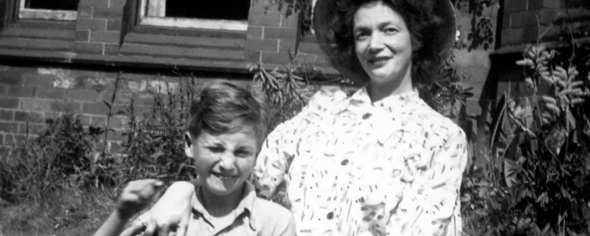 John Lennon's mother, Julia Lennon, posing with young John