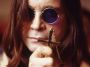 Ozzy Osbourne holding cross
