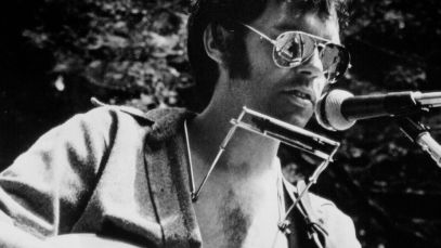 Neil Young performing on outdoor property