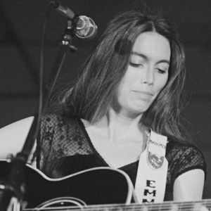 Emmylou Harris playing guitar