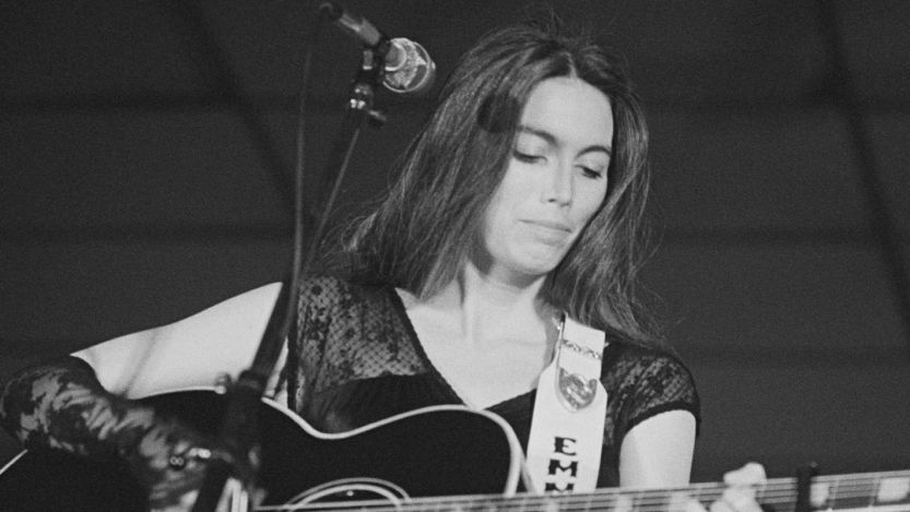 Emmylou Harris playing guitar