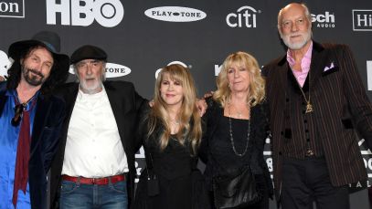 Fleetwood Mac standing next to Mike Campbell