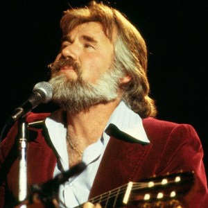 Kenny Rogers performing on stage, 1978. (Photo by David Redfern/Redferns)