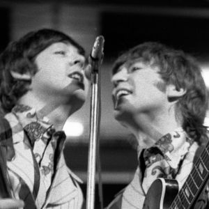 Paul McCartney and John Lennon performing