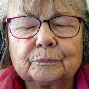 Older woman listening to music