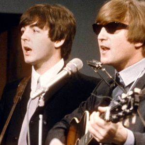 Paul McCartney and John Lennon of The Beatles performing