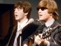 Paul McCartney and John Lennon of The Beatles performing