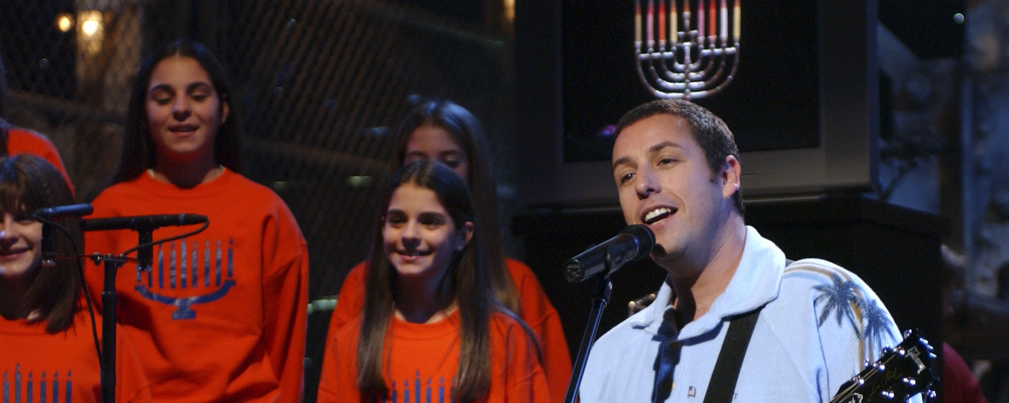 The Story Behind Adam Sandler’s ‘Saturday Night Live’ Holiday Classic “The Chanukah Song” and its Revamps in 1999, 2002, and 2015