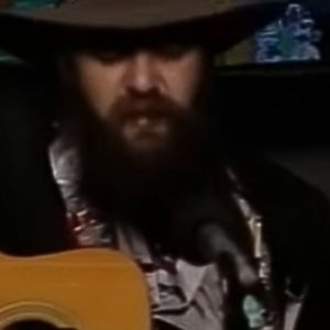 Blaze Foley playing guitar