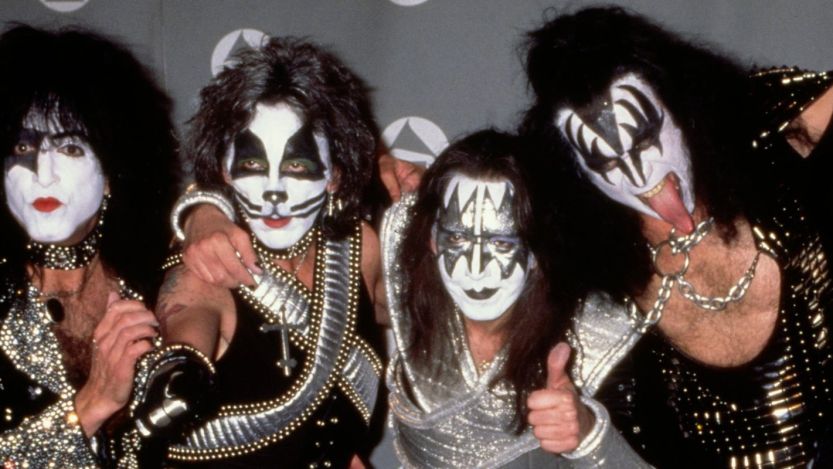 Members of KISS posing in makeup
