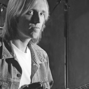 Tom Petty posing with guitar