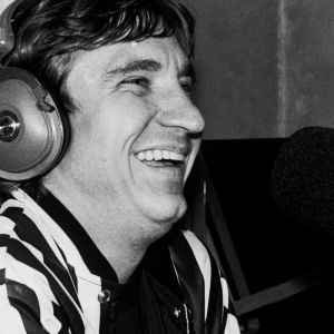 Joe Walsh talking into microphone