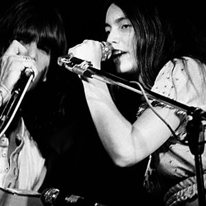 Gram Parsons and Emmylou Harris performing