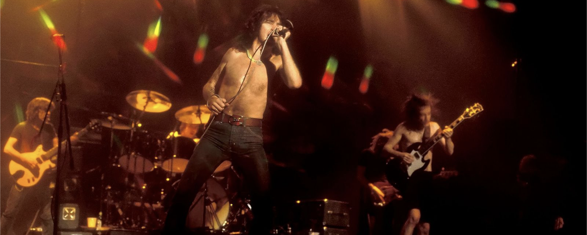 80th Birthday Celebrations for Late AC/DC Frontman Bon Scott Include Tribute Shows, Commemorative Merch, & More