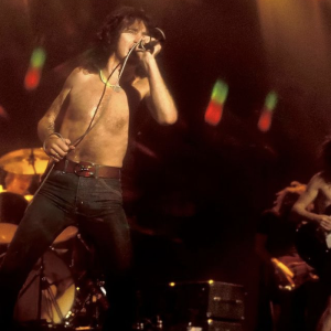 80th Birthday Celebrations for Late AC/DC Frontman Bon Scott Include Tribute Shows, Commemorative Merch, & More