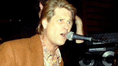 Brian Wilson playing the piano and singing
