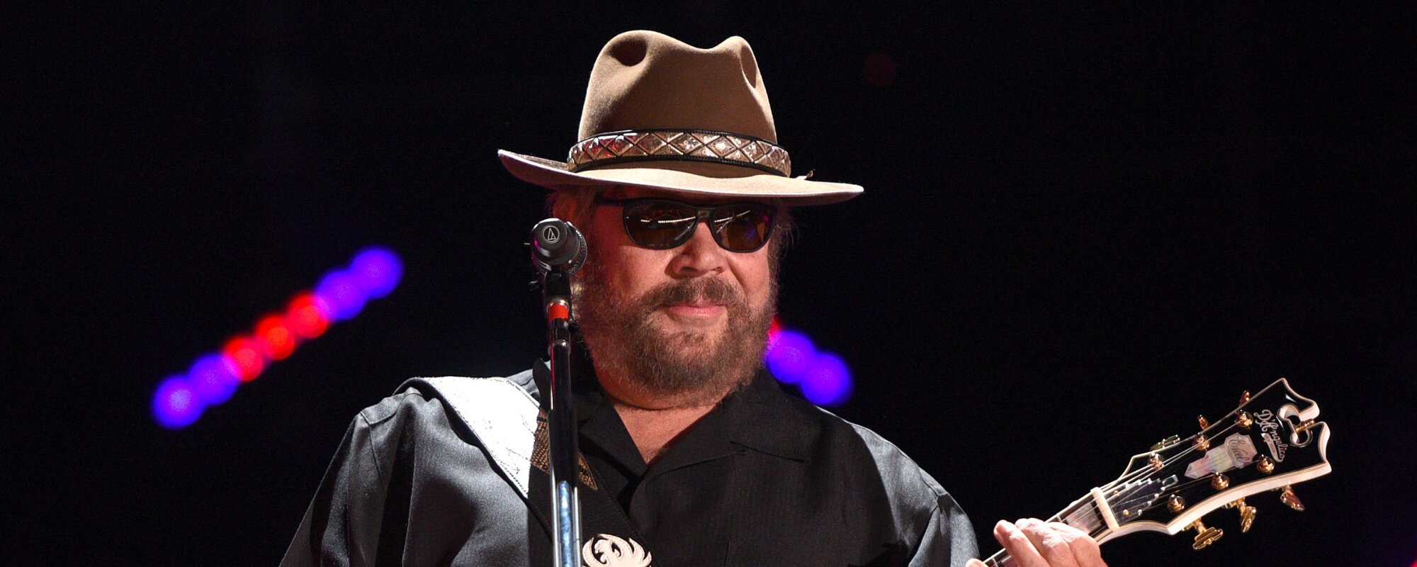 On This Day in 2002, Hank Williams Jr. Took the Opry Stage for the First Time in 20 Years To Pay Tribute to a Fallen Outlaw Country Legend