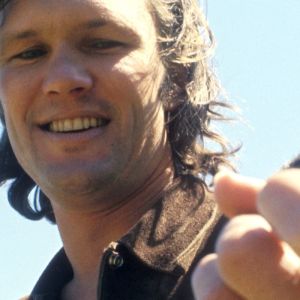 Kris Kristofferson playing guitar