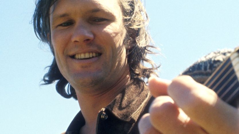 Kris Kristofferson playing guitar