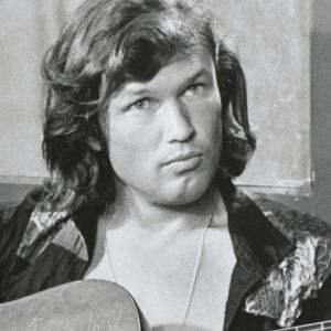 Kris Kristofferson playing guitar