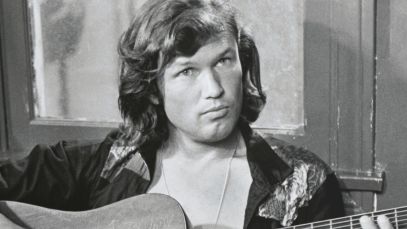 Kris Kristofferson playing guitar