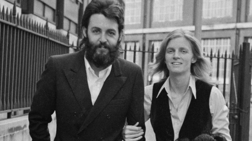 Paul and Linda McCartney walking in the city